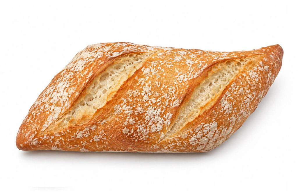 Ración gourmet de pan de 130 gramos con corteza dorada y acabado rústico.