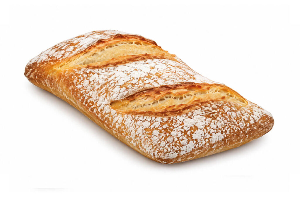 Ración gourmet de pan de 85 gramos con corteza dorada y acabado rústico.